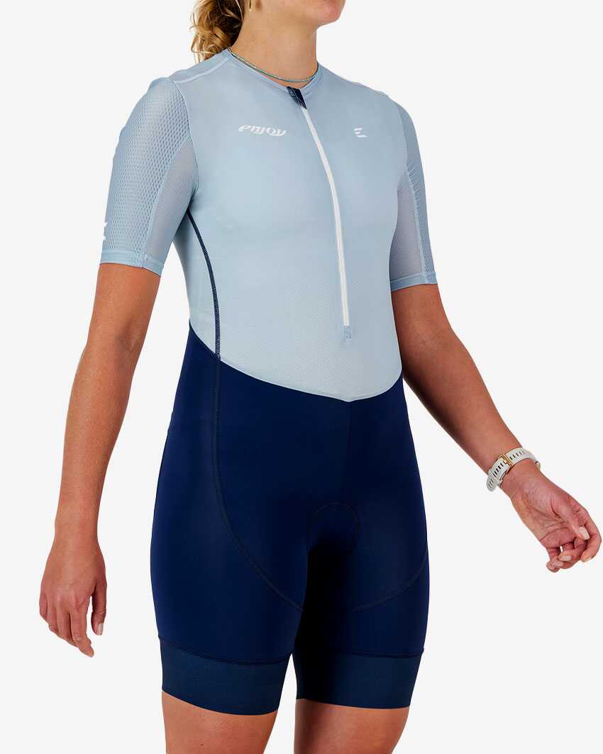 Side view of the women's sleeved triathlon suit in a fresh blue design made by enjoy.cc